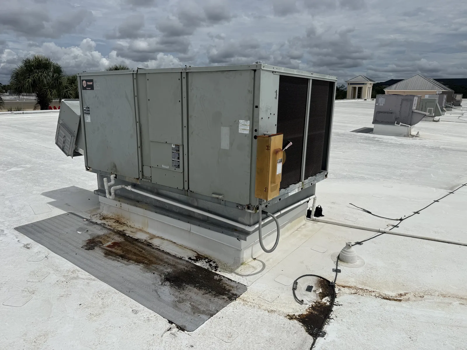 Commercial package unit on a rooftop at the Ellenton outlet mall during service